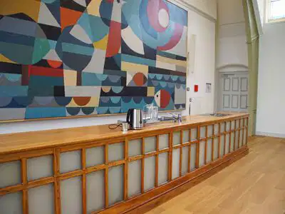 Betazaal bij de buren